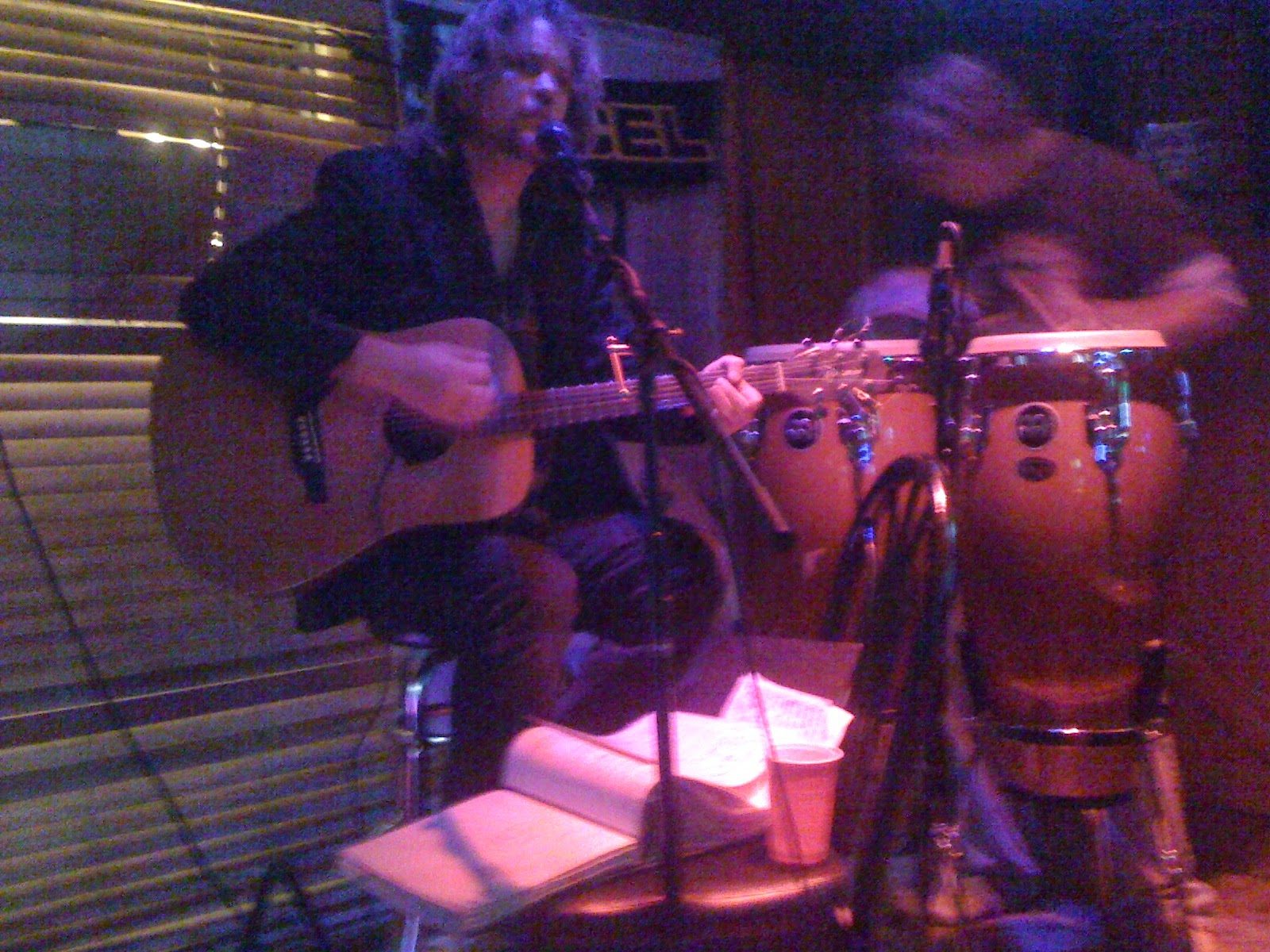 V singing and playing acoustic guitar live